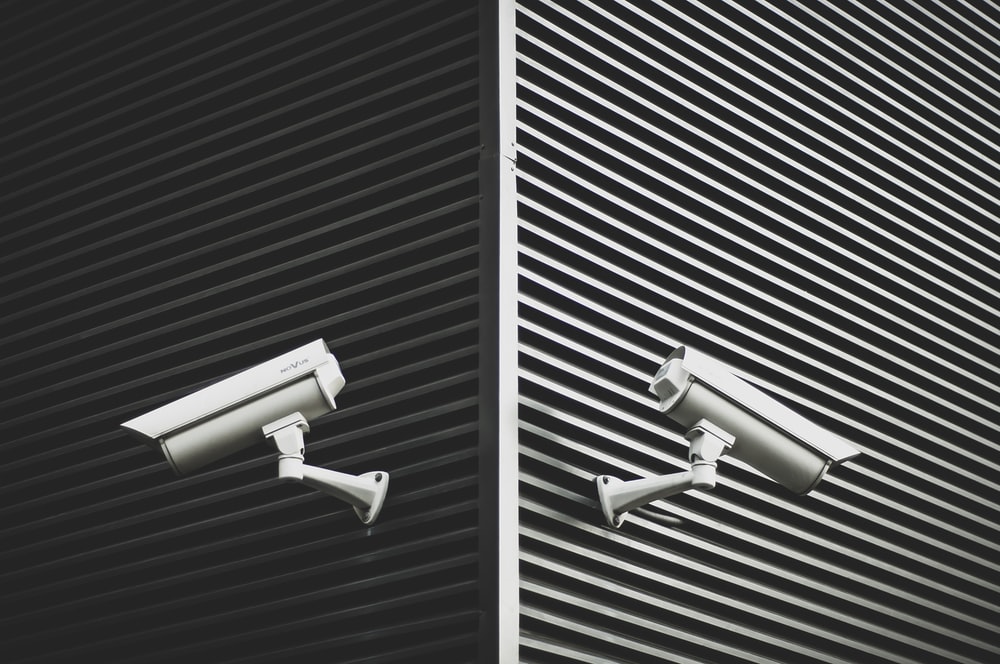 Two CCTV cameras in a hospital to control access.