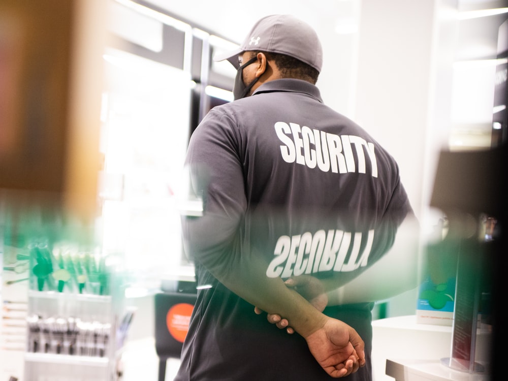 A security guard on duty in a retail store.